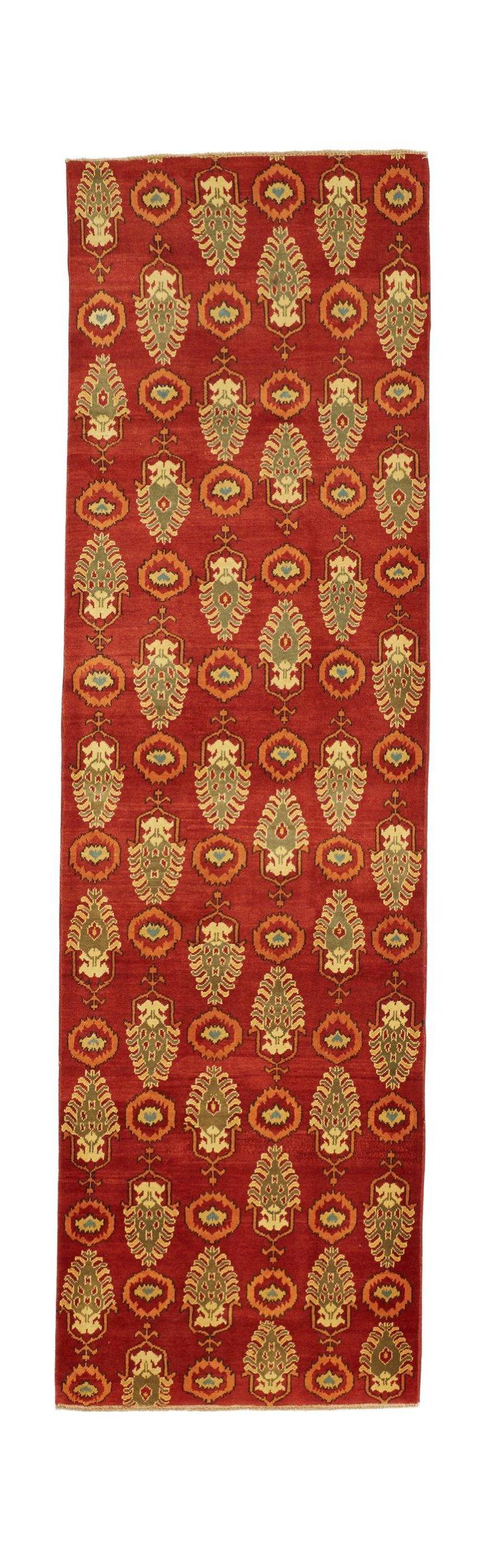 Handmade Afghan Chobi runner rug featuring a repeating floral motif on a deep red background.