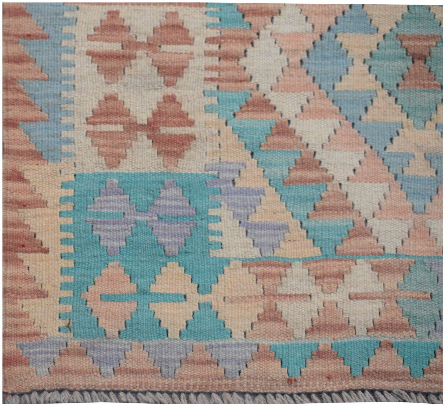 Handmade Afghan Maimana kilim runner featuring a geometric pattern in soft pastel tones.