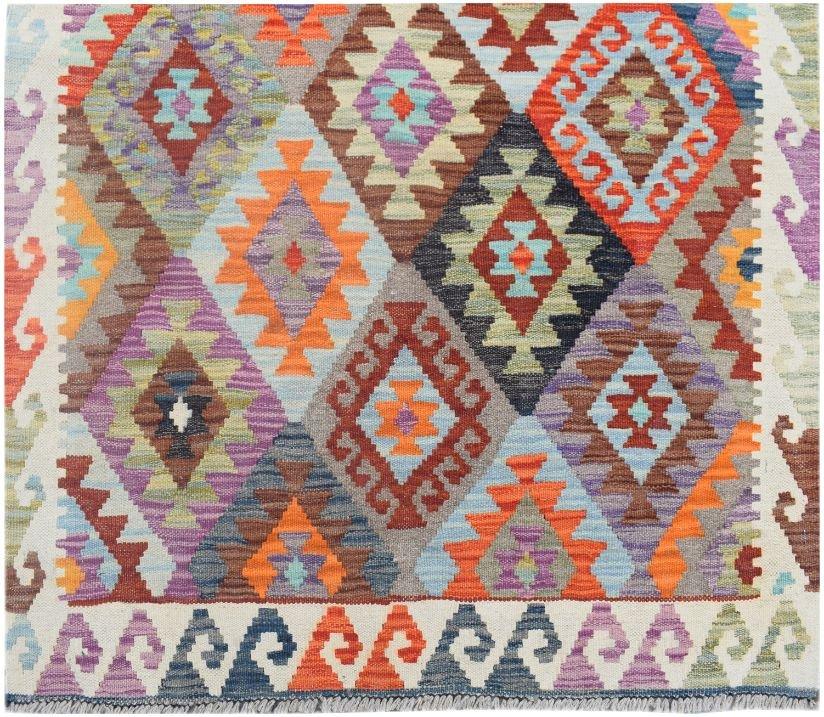 Handmade Afghan Maimana wool runner rug featuring a colorful geometric diamond pattern.