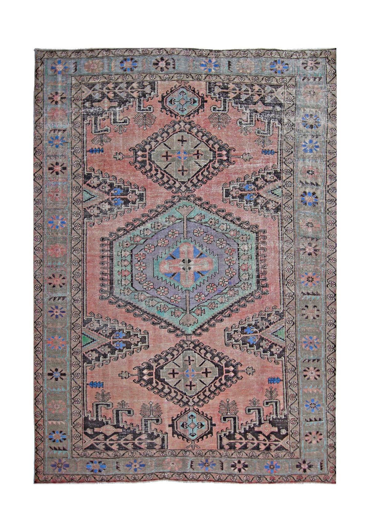 Vintage Persian Wiss wool rug featuring a pink field, geometric medallions, and intricate tribal motifs in blue and grey.