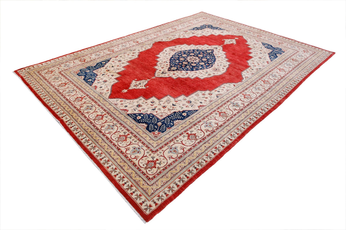 A rectangular Afghan Balkh rug featuring a central blue medallion on a red field with floral motifs.