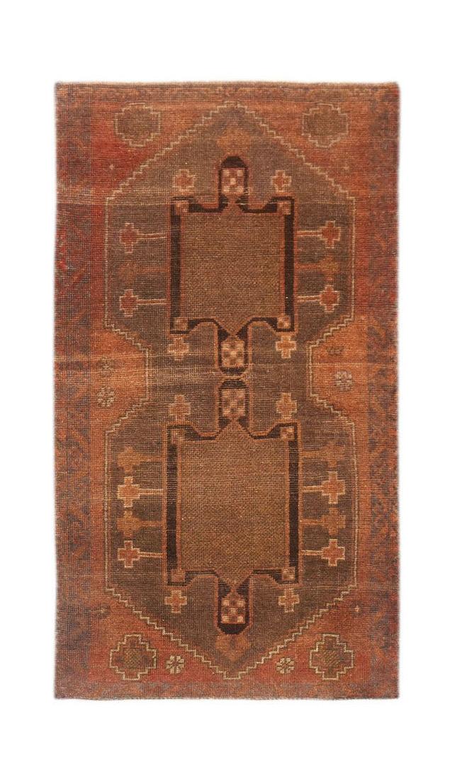 Handmade Afghan Baluch rug featuring a geometric brown and rust-colored pattern.