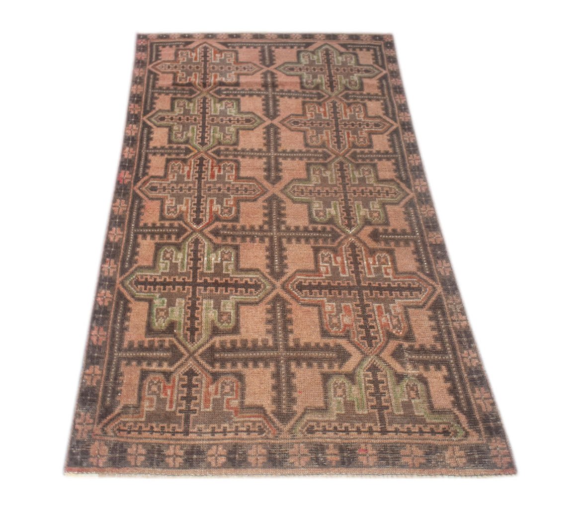 Handmade Afghan Baluch rug featuring a geometric cross pattern in muted earth tones.