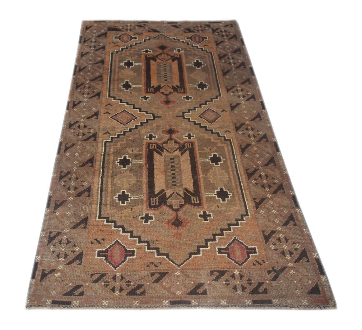 Handmade Afghan Baluch wool rug featuring a geometric pattern in shades of brown and tan.