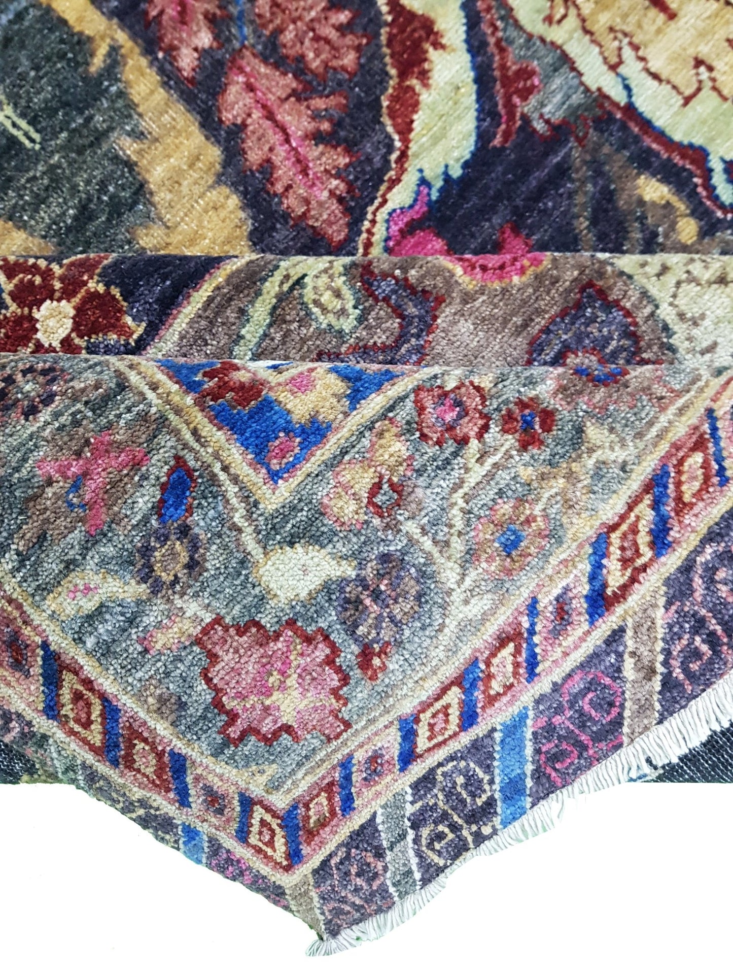 A handwoven Afghan Chobi rug featuring a traditional Bidjar pattern in vibrant, multi-colored wool.