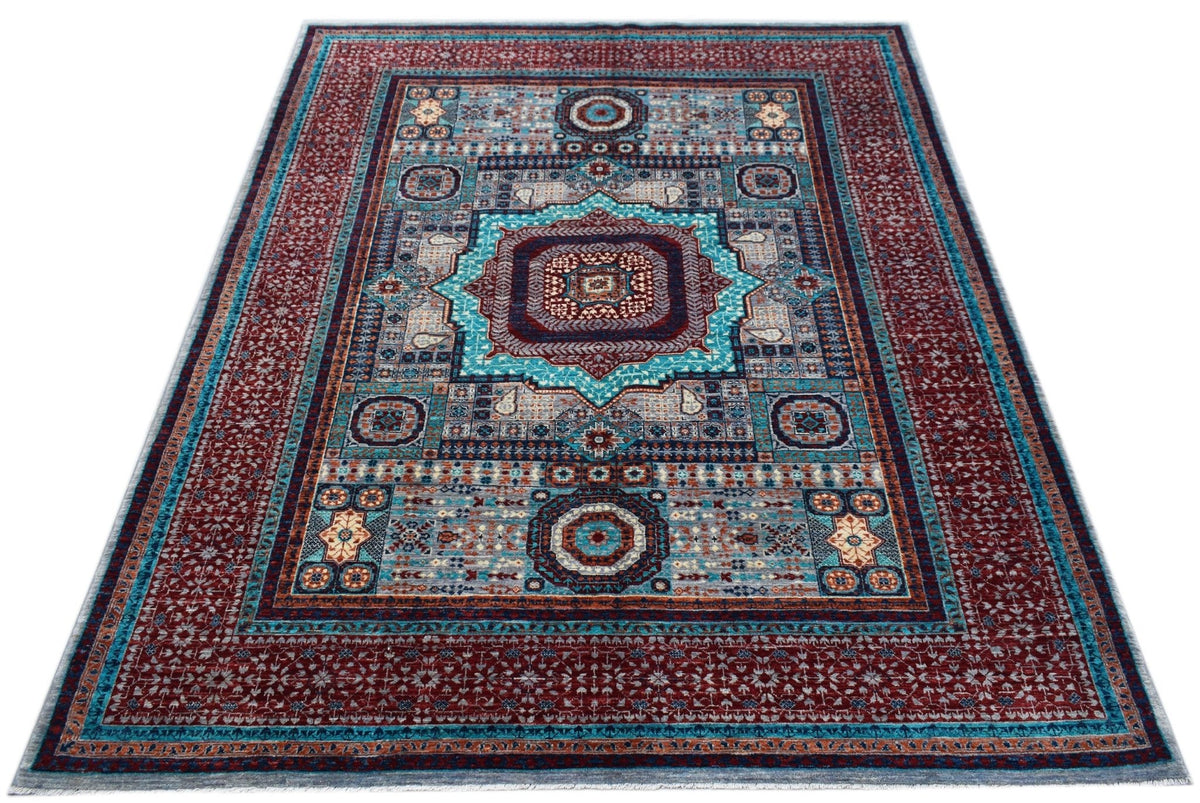 Hand-knotted Afghan Chobi rug featuring a geometric Mamluk design in deep red, teal, and cream with a low-pile wool finish.