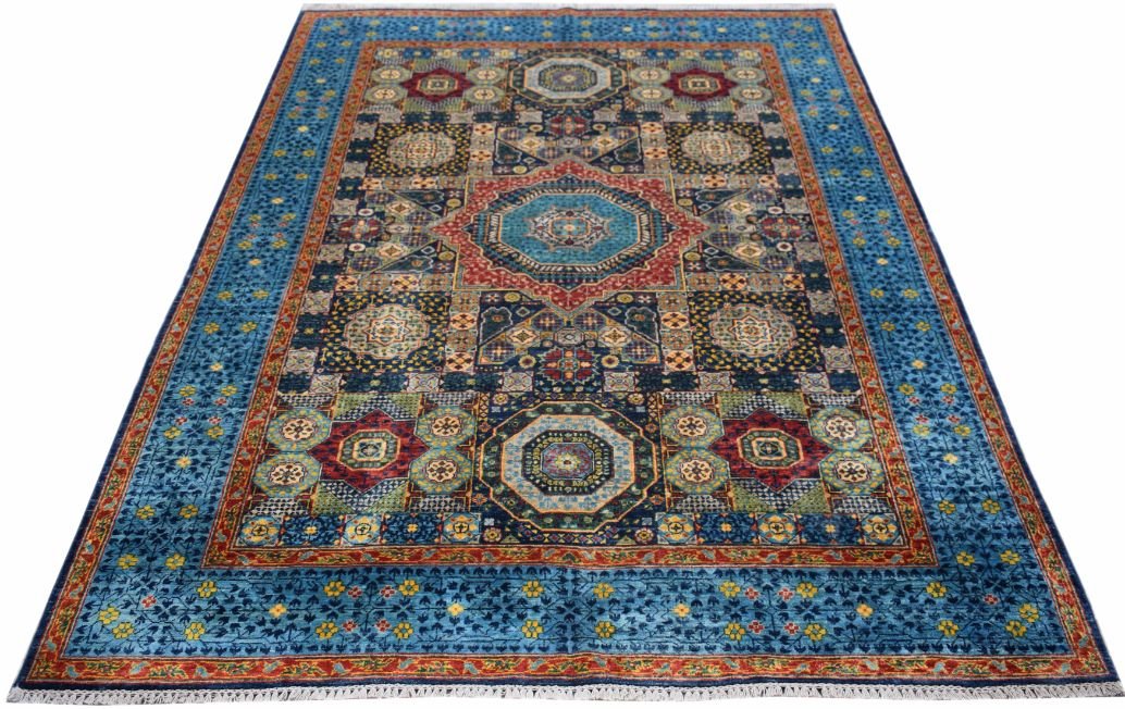 A handmade Afghan Chobi rug featuring a blue field with intricate red and gold geometric medallions.