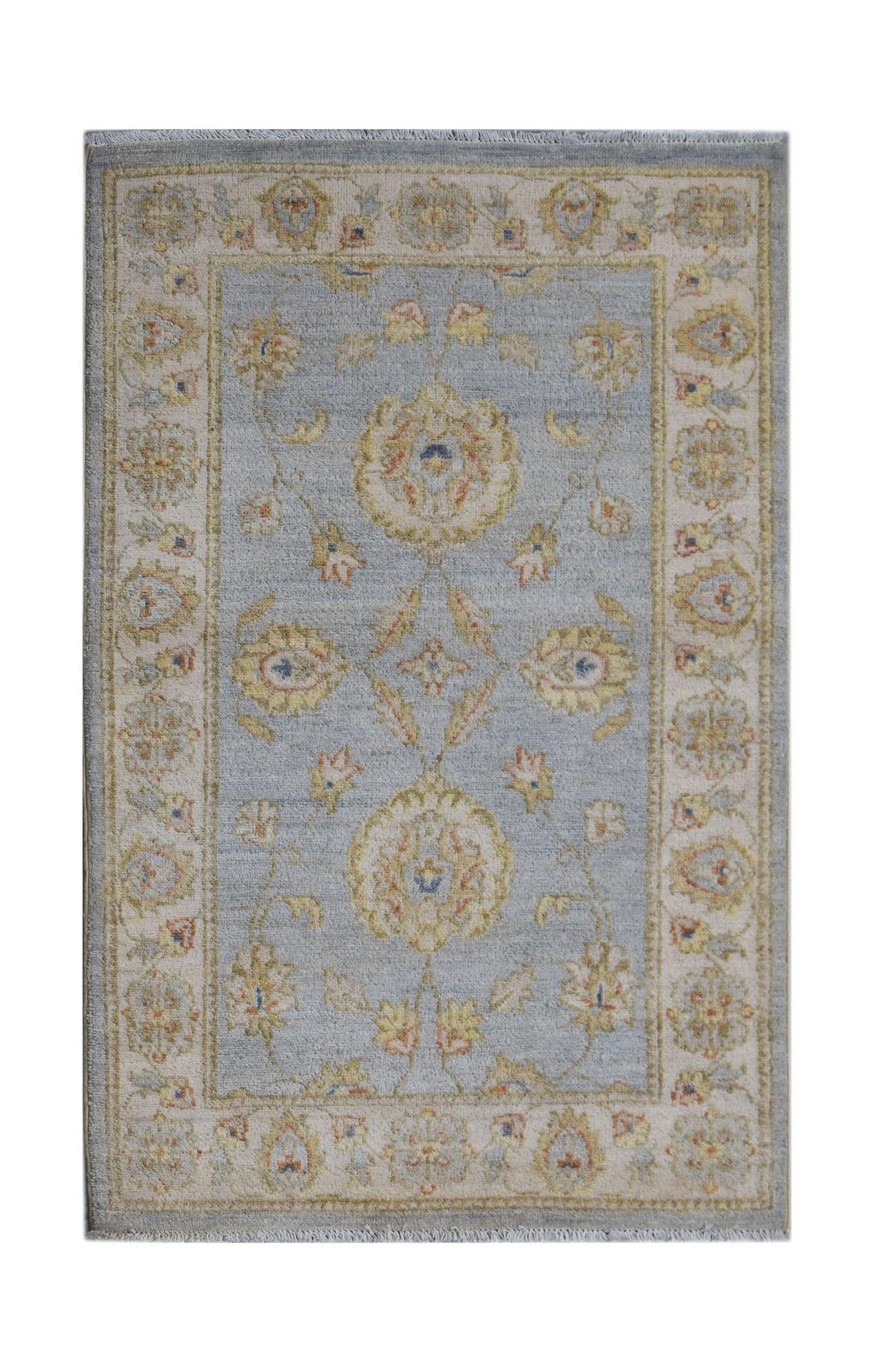 Handwoven Afghan Chobi rug featuring a light blue field with traditional floral patterns.