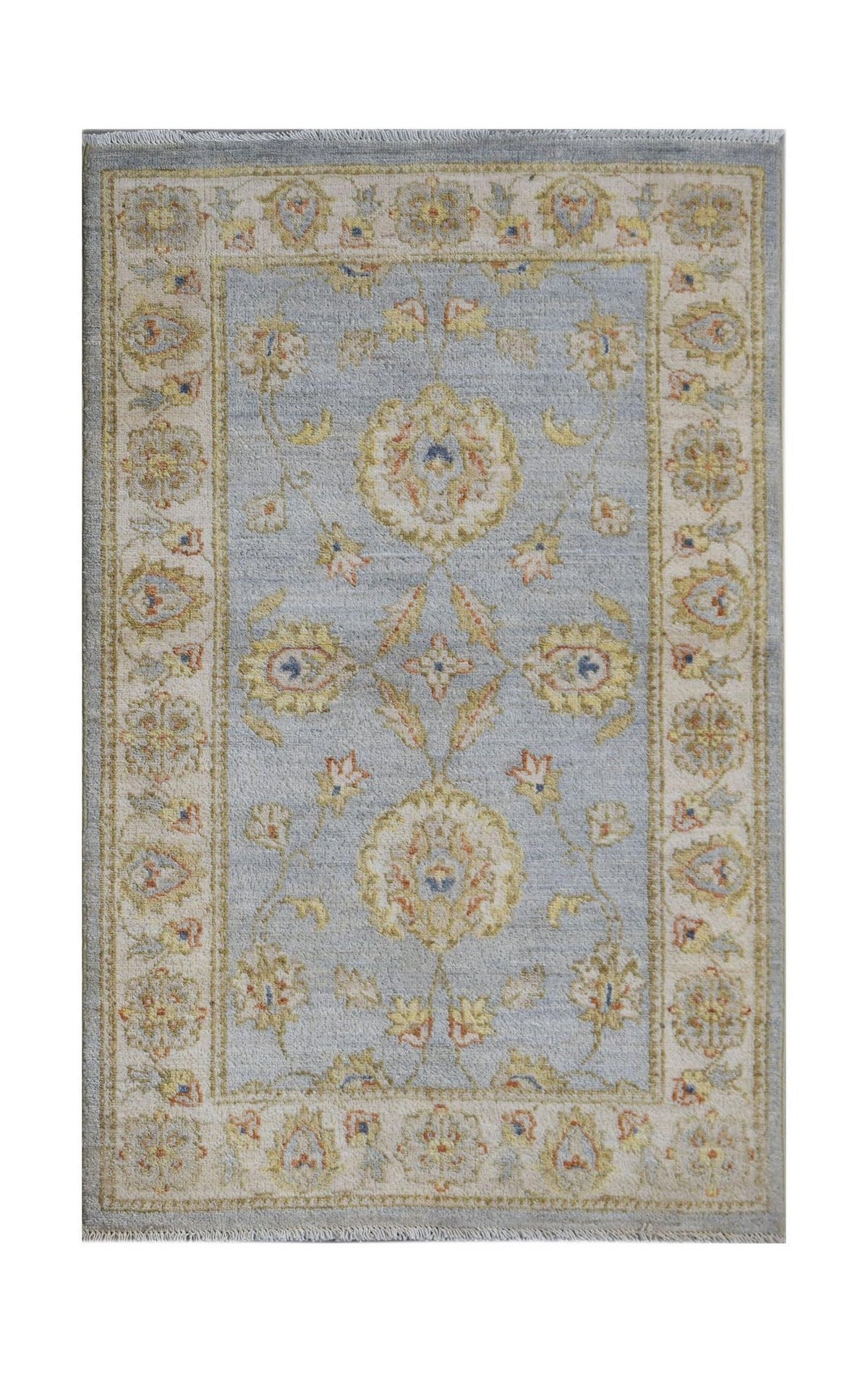 An Afghan Chobi rug featuring a light blue field with traditional floral patterns and a cream border.