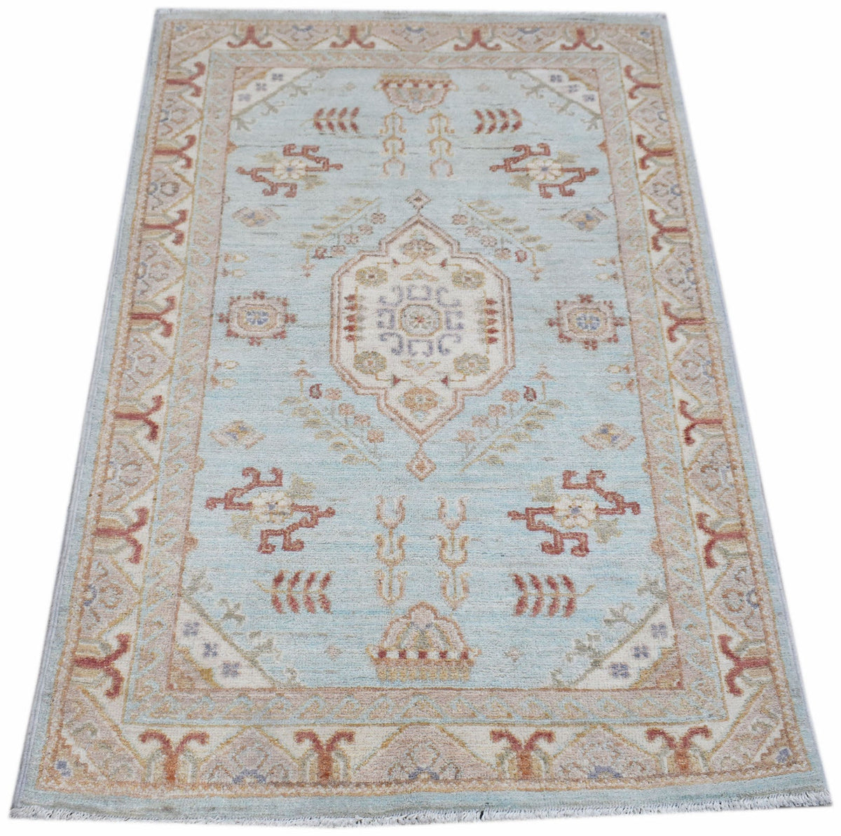 A rectangular Afghan Chobi rug featuring a traditional floral pattern in soft blue and beige tones.