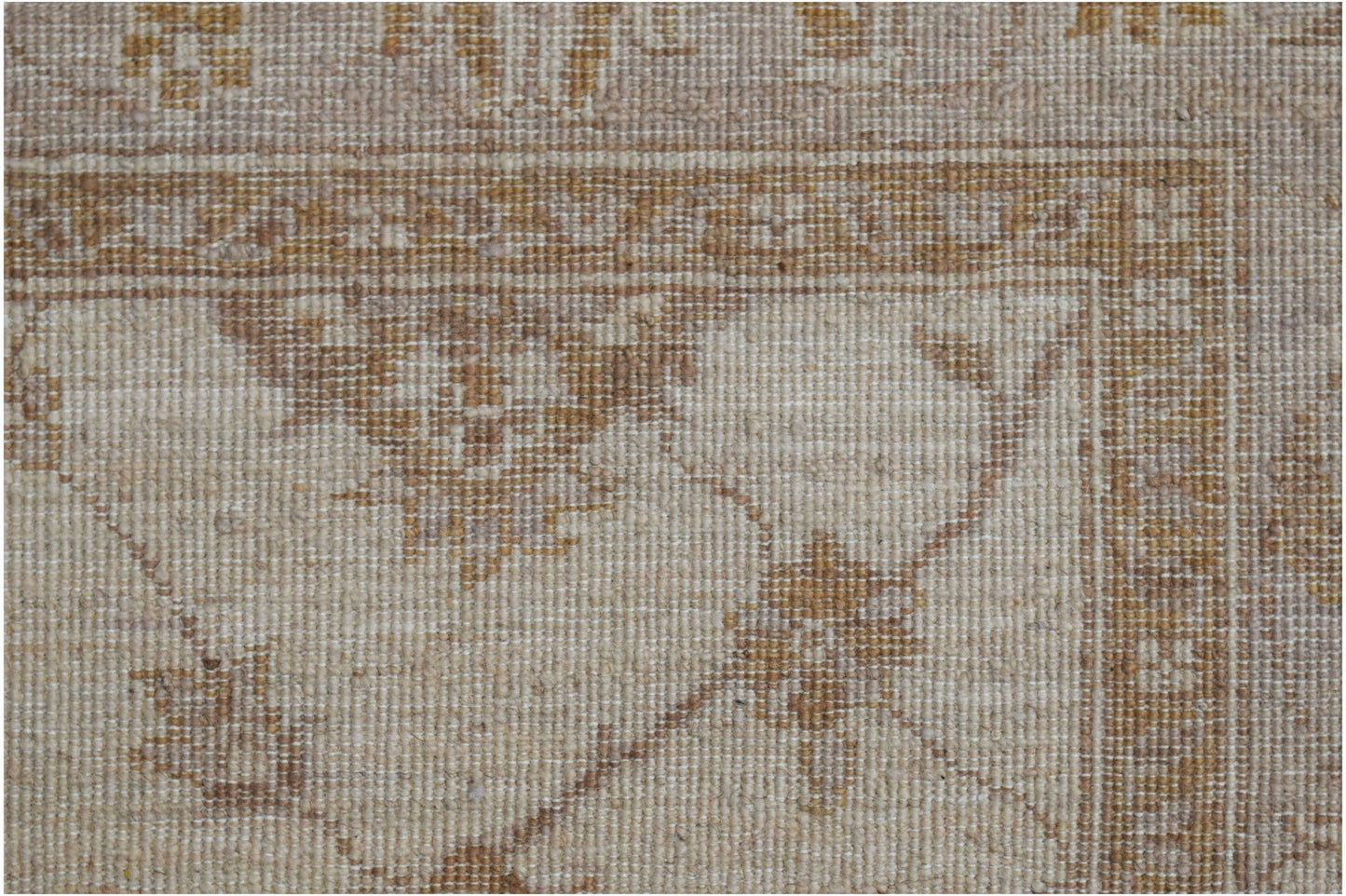 A close-up of a handwoven Afghan Chobi rug featuring traditional floral patterns in earthy tones.