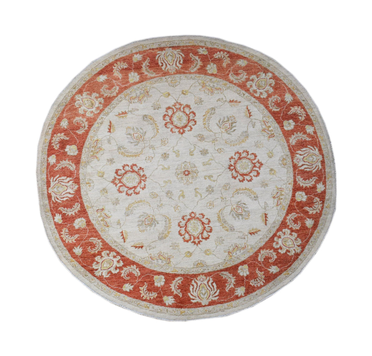 Round hand-knotted Afghan Chobi rug featuring a cream centre with intricate rust-red floral borders and motifs.
