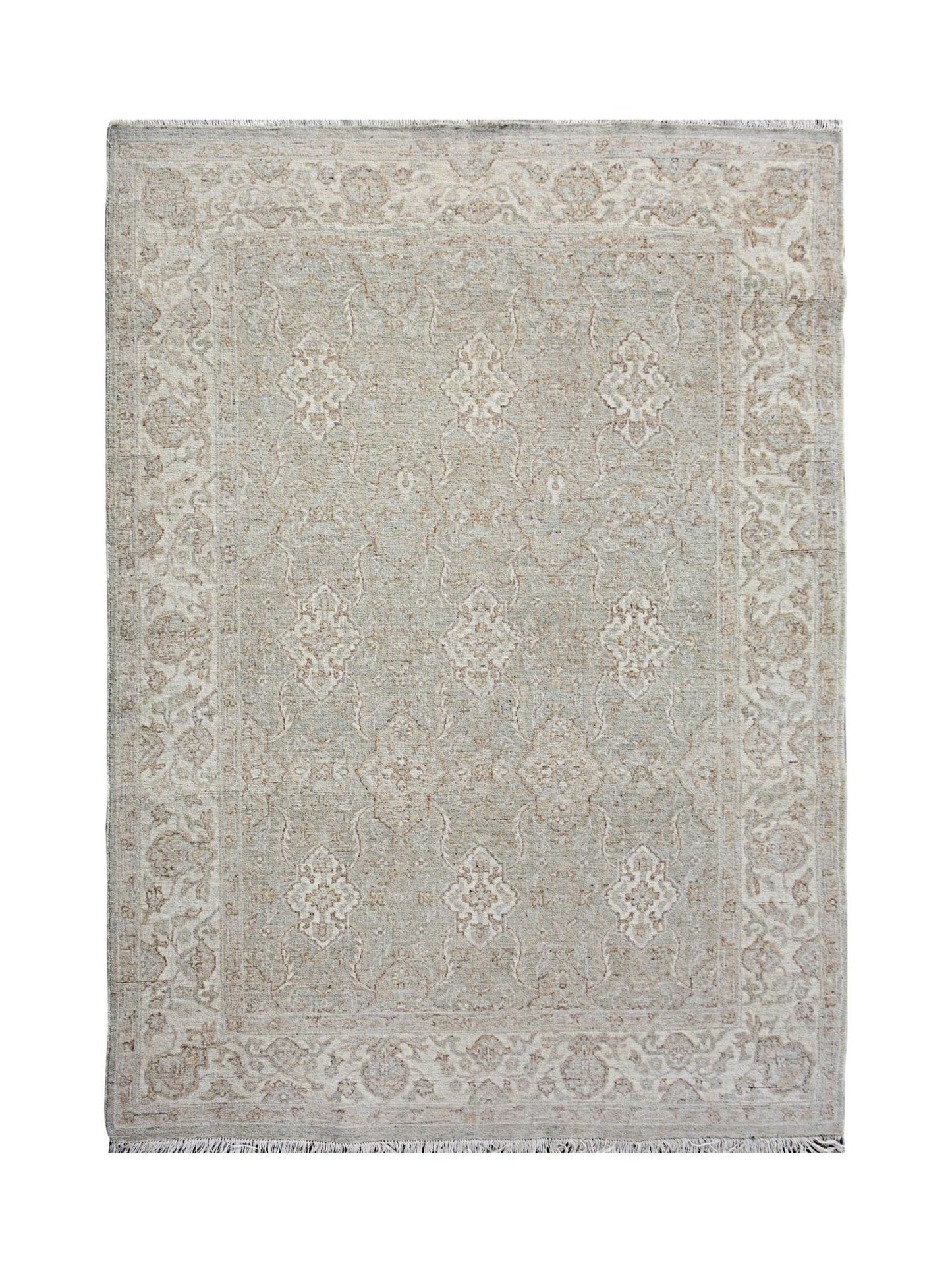 A handmade Afghan Chobi rug featuring a traditional floral pattern in soft beige and grey tones.