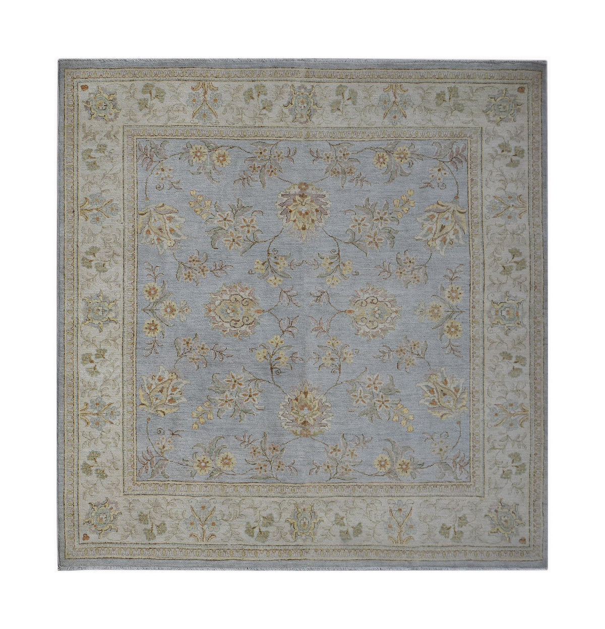 A rectangular Afghan Chobi rug featuring a light blue field with a traditional floral pattern.