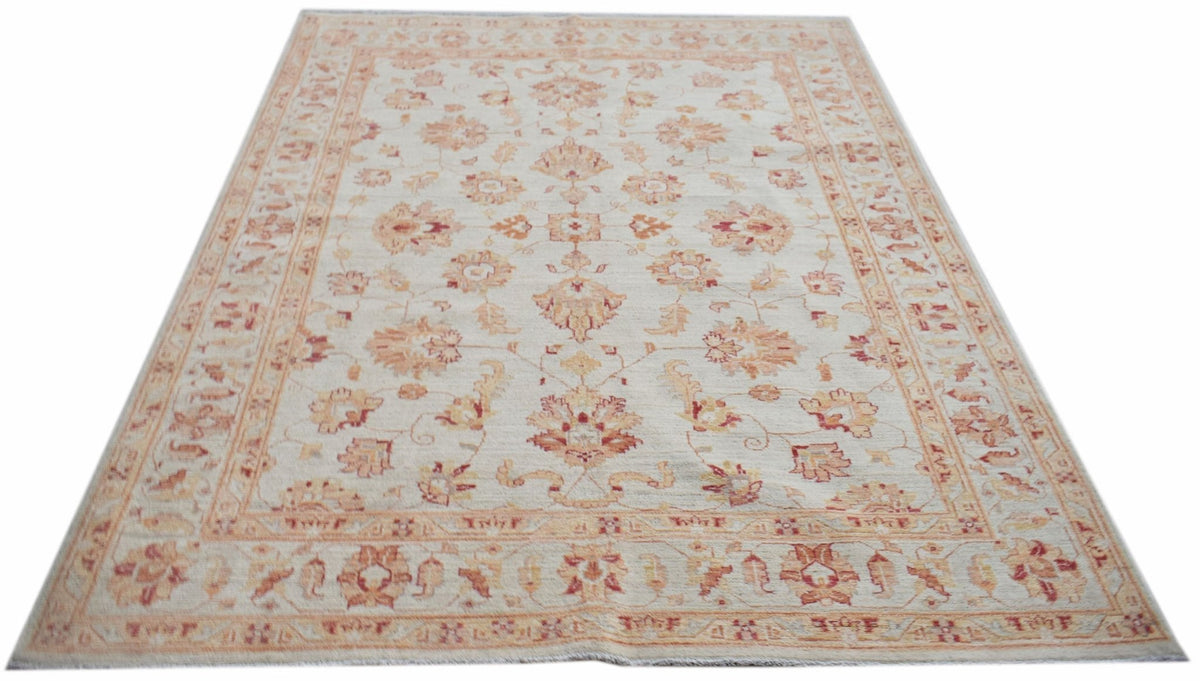 A rectangular Afghan Chobi rug featuring a traditional floral pattern in soft earth tones.