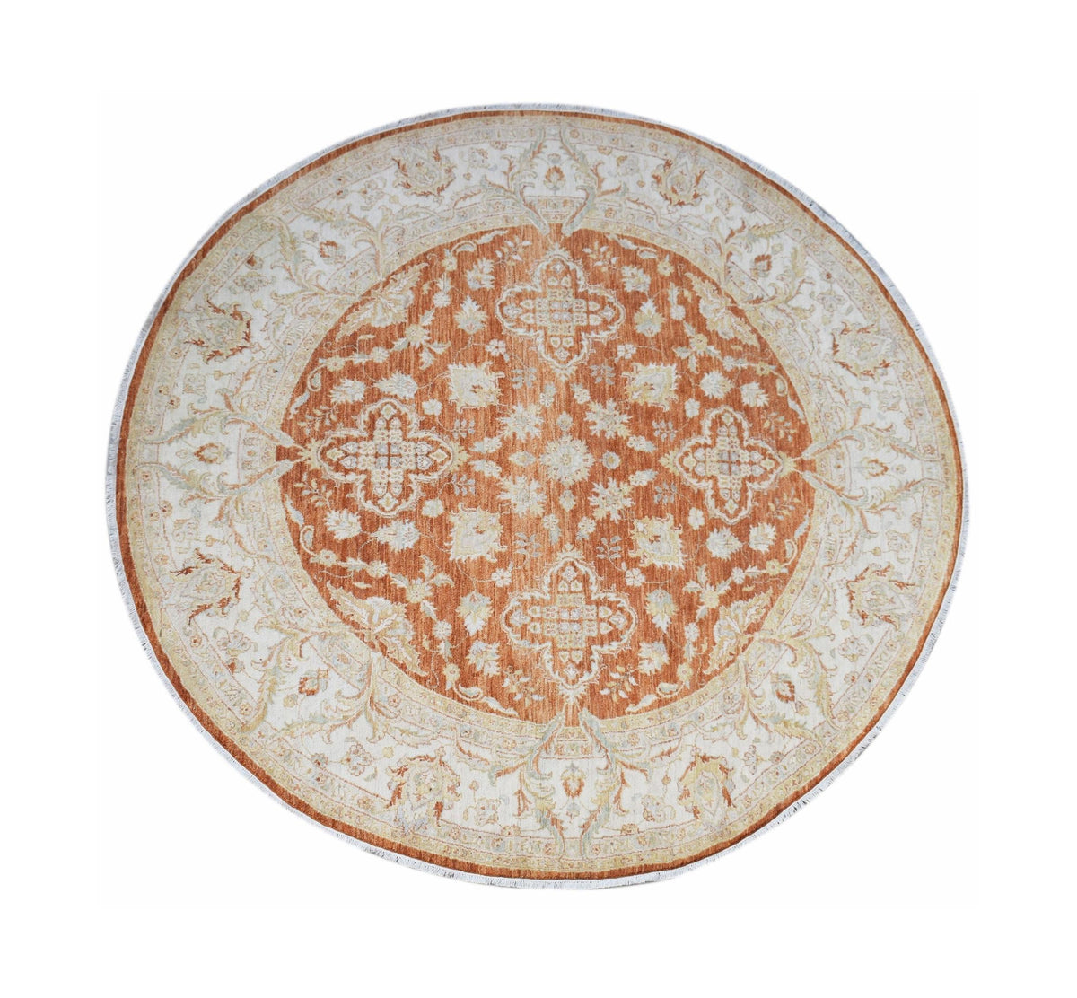A round, handwoven Afghan Chobi rug featuring a traditional floral pattern in rust and cream tones.