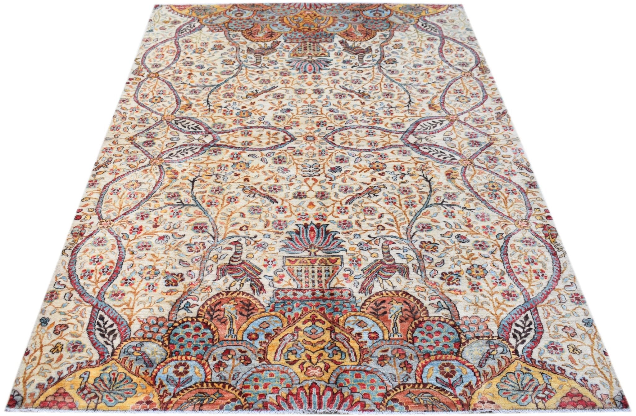 An Afghan Chobi rug featuring a traditional floral and bird pattern in warm, earthy tones.