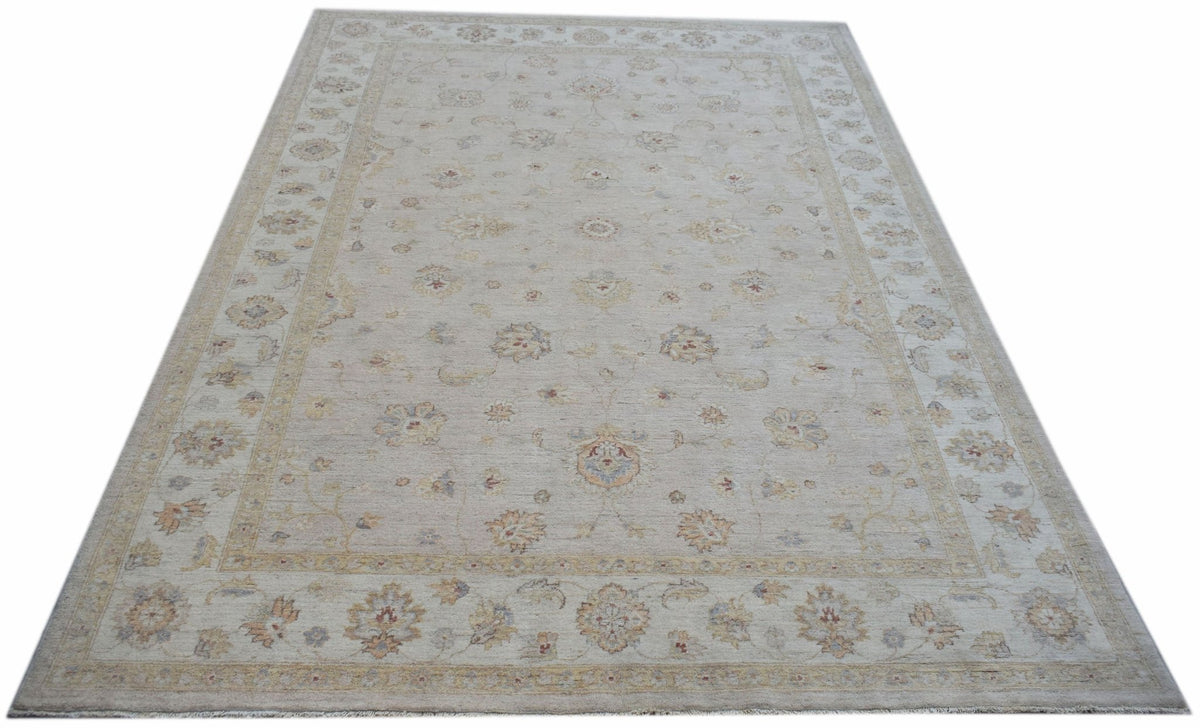 An Afghan Chobi rug featuring a traditional floral pattern in soft, neutral wood tones.