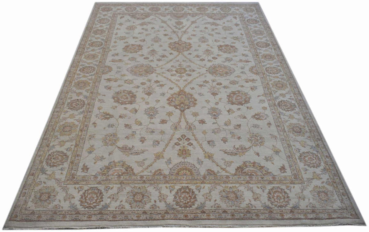 An Afghan Chobi rug featuring a traditional floral pattern in soft, earthy wood tones.