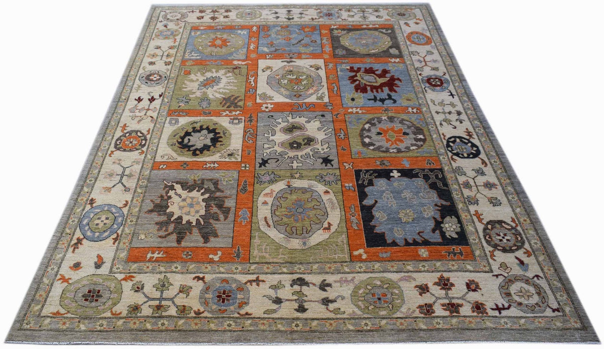 An Afghan Chobi rug featuring a patchwork of colorful geometric and floral motifs.