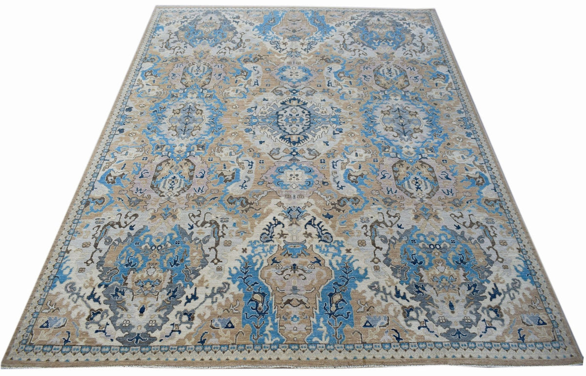 Handwoven Afghan Chobi rug featuring a traditional floral pattern in blue, beige, and grey tones.