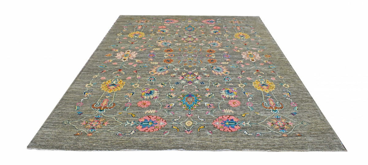 Handwoven Afghan Chobi rug featuring a floral pattern in vibrant colors on a grey wool background.
