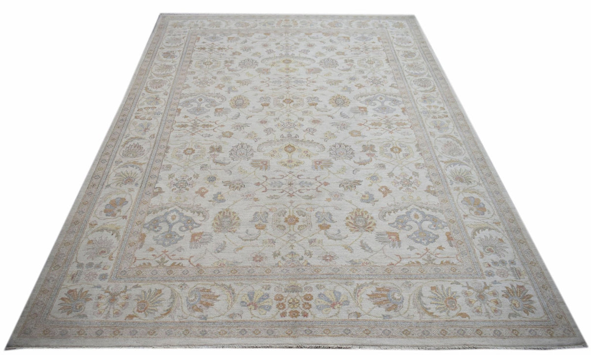 A rectangular Afghan Chobi rug featuring a traditional floral pattern in soft, neutral tones.