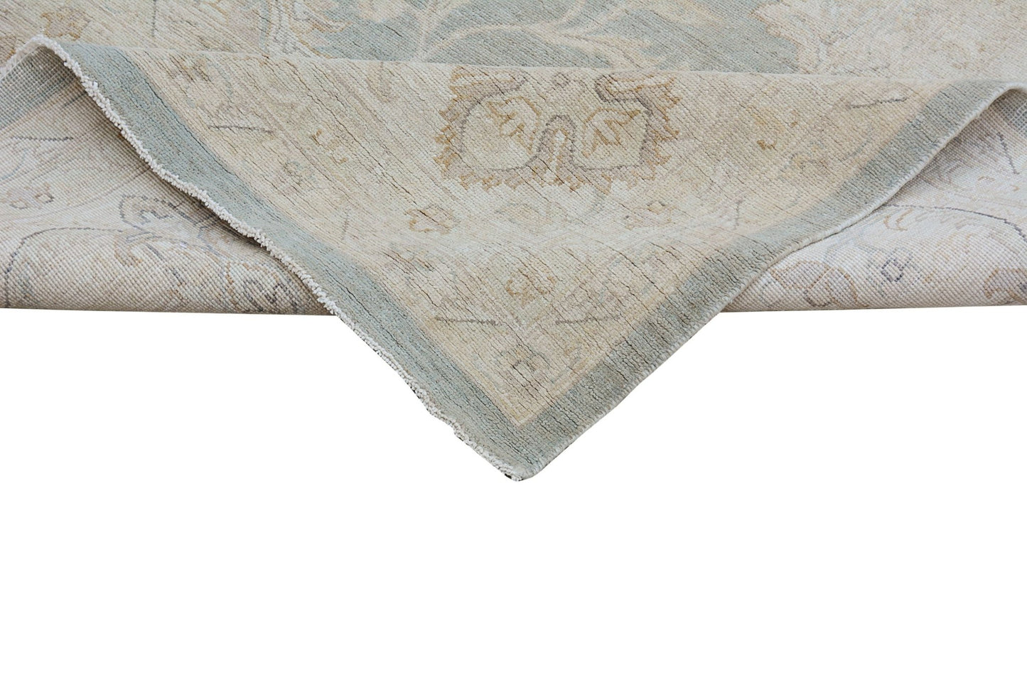 A handmade Afghan Chobi rug featuring a traditional floral pattern in soft beige and blue tones.