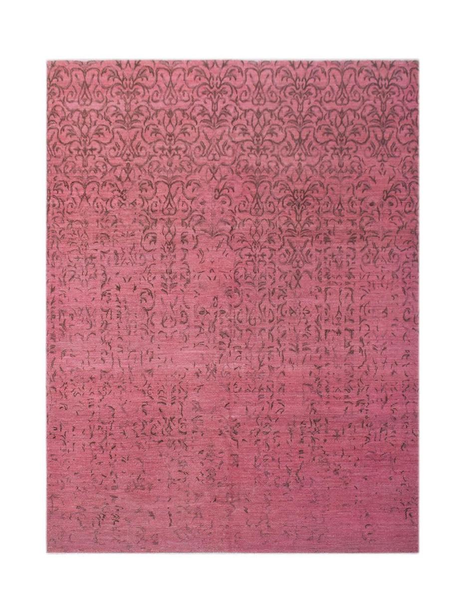 An overdyed Afghan Chobi rug featuring a dark floral damask pattern fading into a solid pink base.