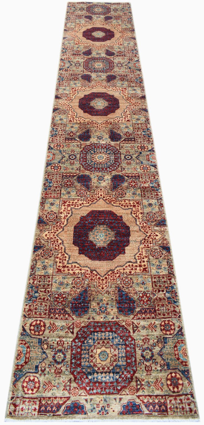 A handmade Afghan Chobi runner rug featuring a series of intricate blue and red Mamluk medallions.