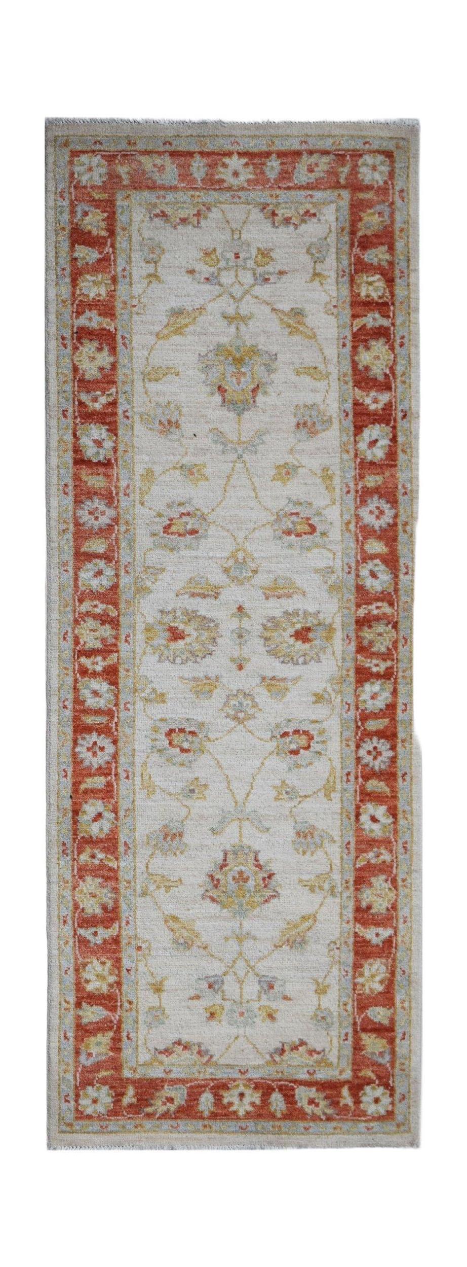An Afghan Chobi runner rug featuring a floral pattern in red, cream, and soft blue tones.