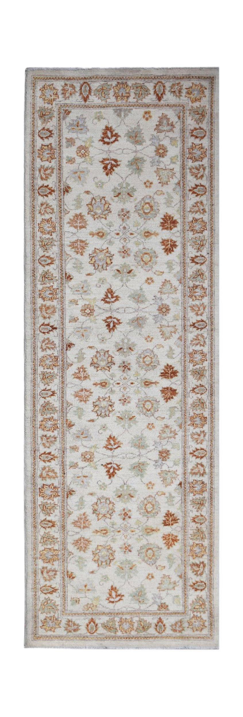 An Afghan Chobi runner rug featuring a traditional floral pattern in earthy tones on a light base.