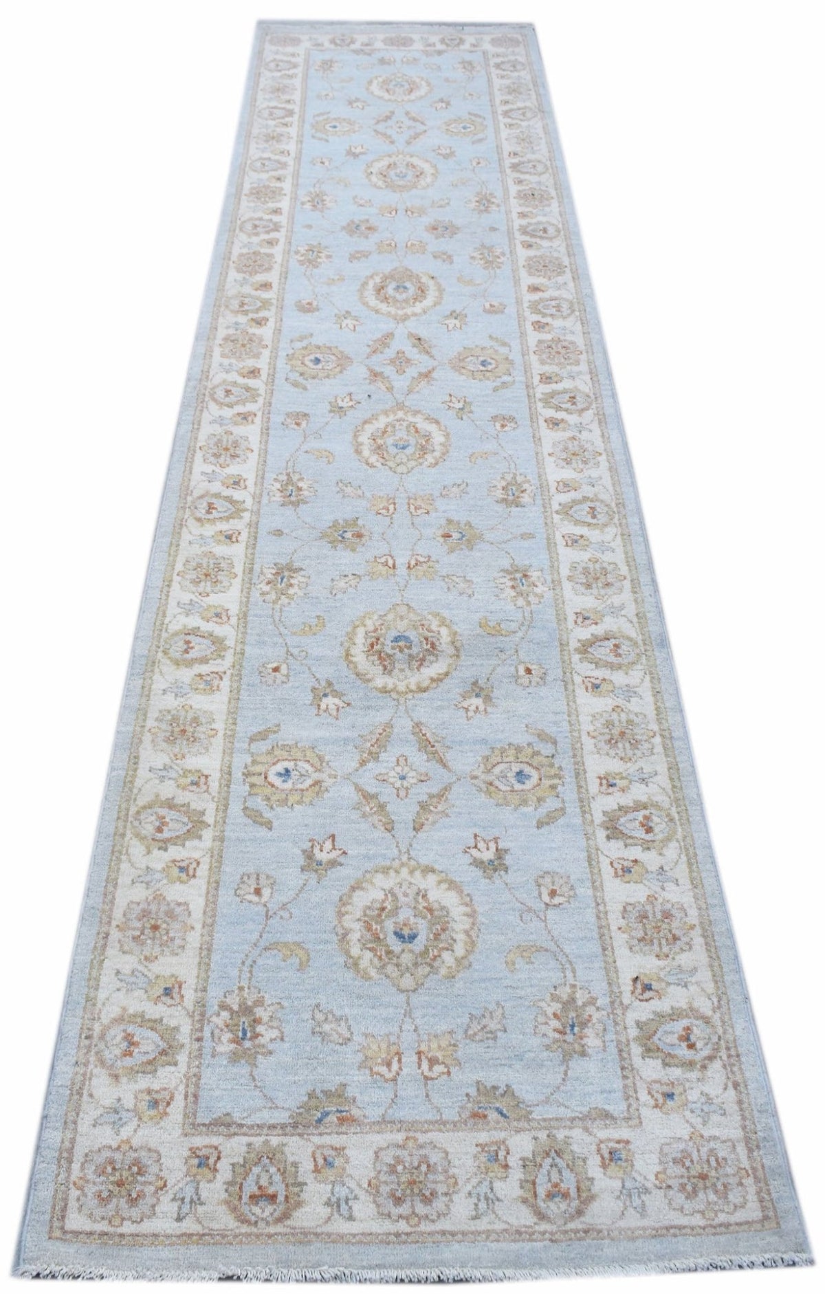 Hand-knotted Afghan Chobi runner in light blue with intricate floral motifs and a traditional cream border.