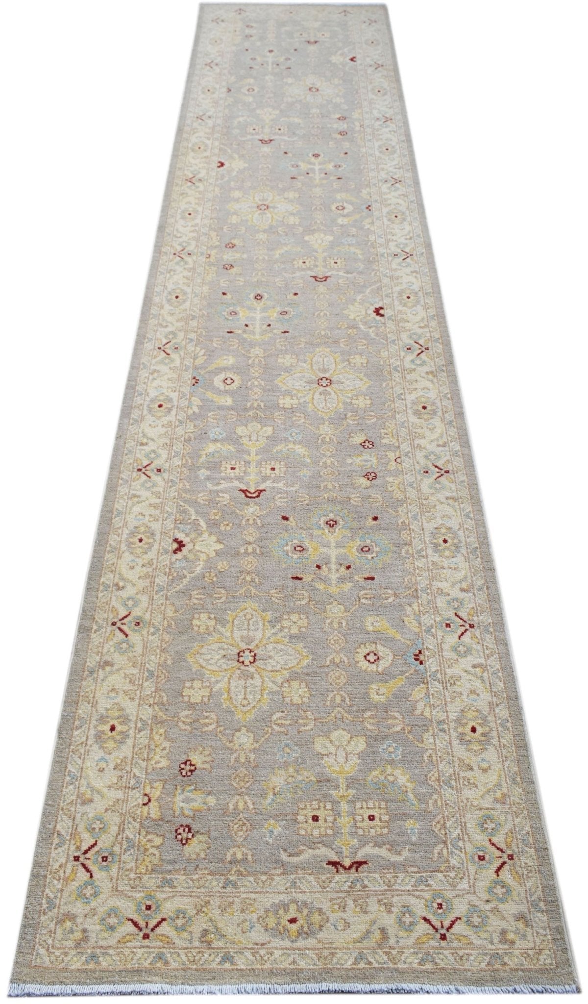 Hand-knotted Afghan Chobi runner in soft grey with intricate floral motifs in yellow, blue, and red on a low-pile wool.