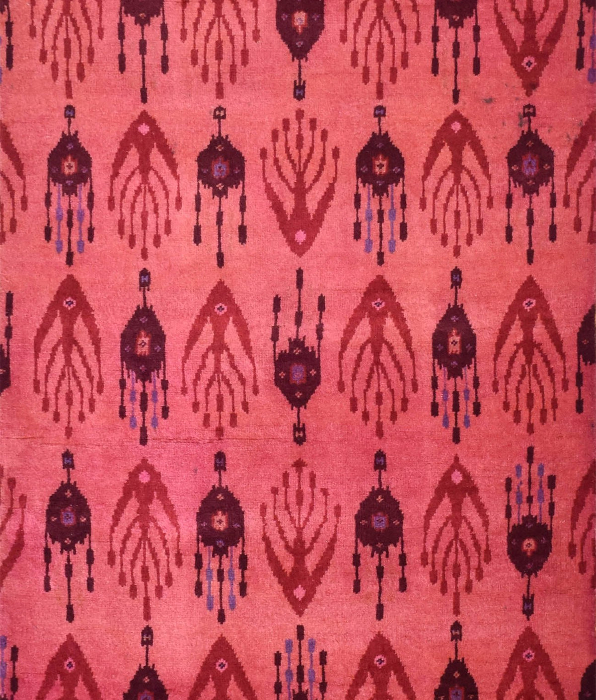 Handmade Afghan Chobi runner featuring a repeating geometric ikat pattern in shades of red.