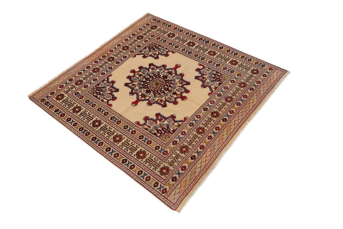 Hand-knotted Afghan Herati rug with a cream field, intricate red and blue geometric motifs, and a detailed border.