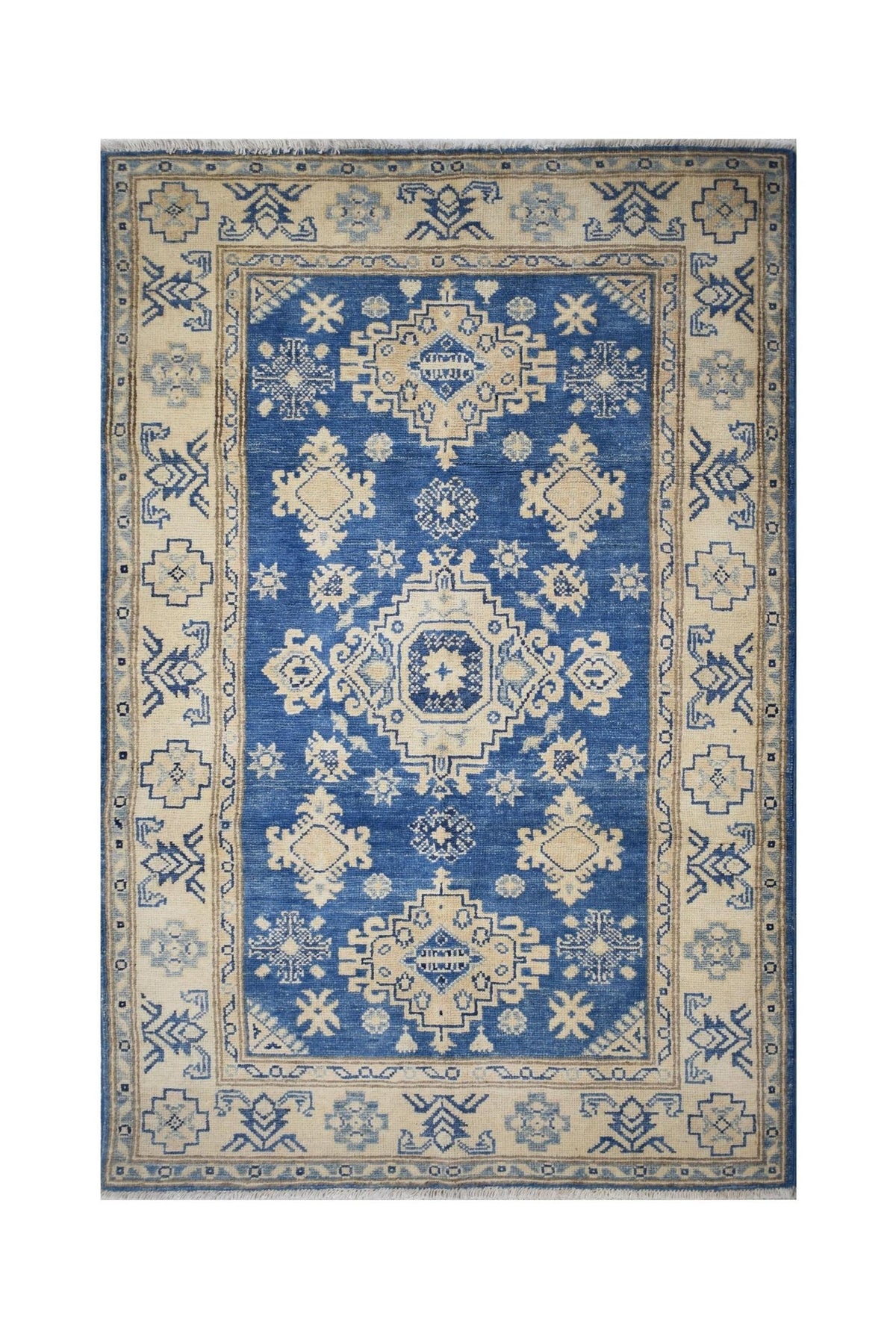 Handmade Afghan Kazakh rug featuring a blue field with cream geometric patterns and a floral border.