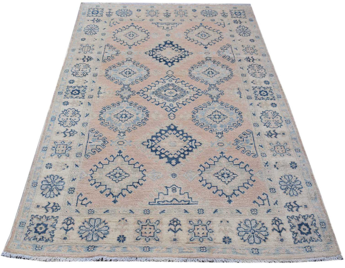 Handmade Afghan Kazakh rug featuring blue geometric and floral motifs on a light beige background.
