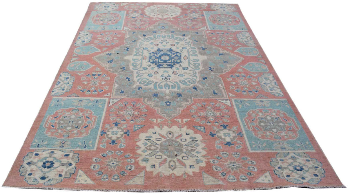 Handmade Afghan Kazakh rug featuring traditional geometric motifs in shades of pink, blue, and grey.