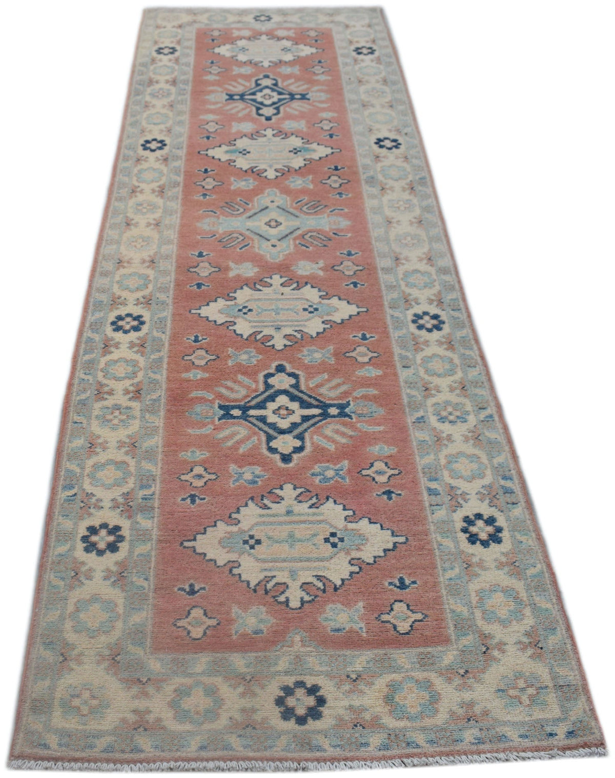 A handmade Afghan Kazakh runner rug featuring traditional geometric motifs in pink and blue tones.