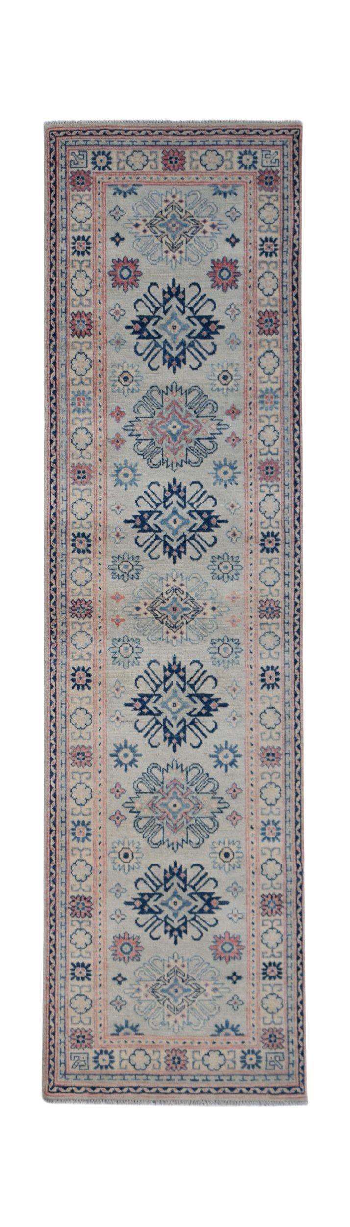 Handmade Afghan Kazakh runner rug featuring traditional geometric motifs in blue and pink tones.