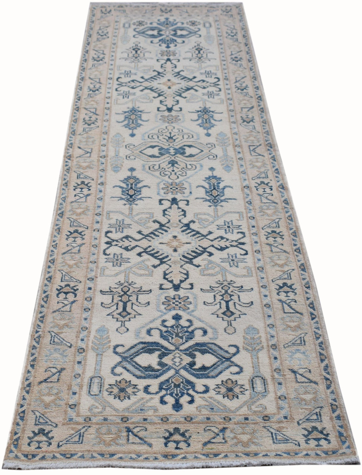 Afghan Kazakh runner featuring blue and beige geometric medallions and hooked motifs on a cream field with fringed ends.