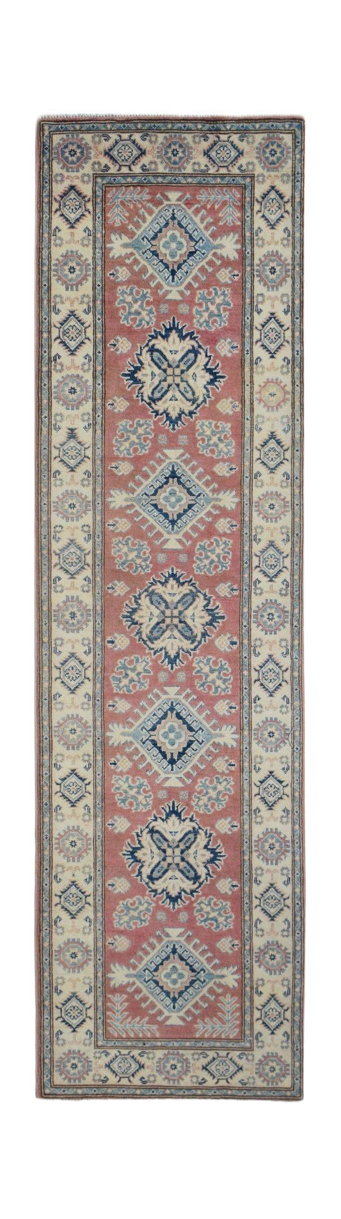 Handmade Afghan Kazakh runner rug featuring traditional geometric motifs in red, blue, and cream.