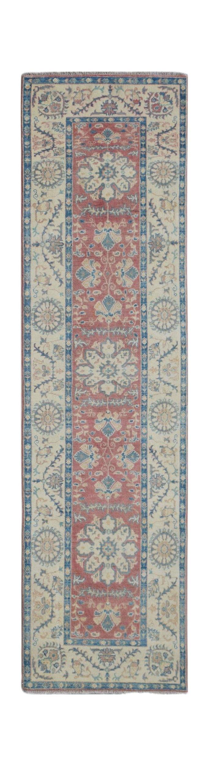 Handmade Afghan Kazakh runner rug featuring traditional floral motifs in red, blue, and cream.