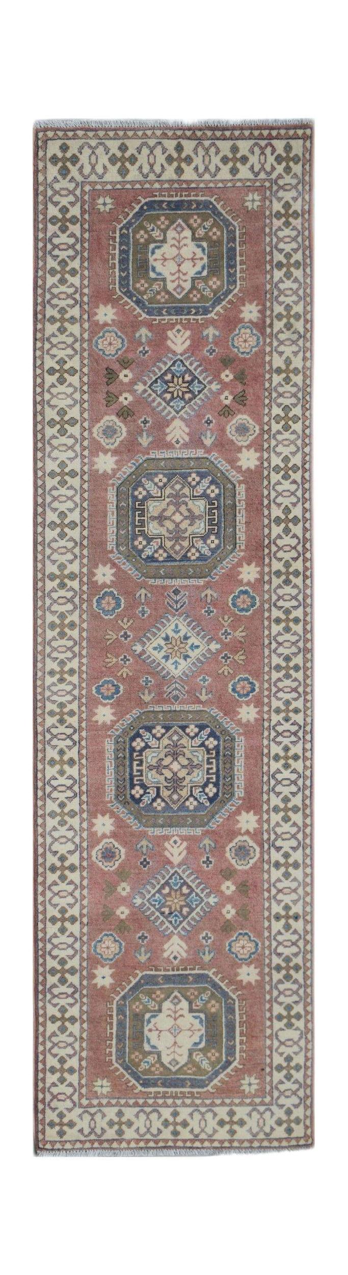 An Afghan Kazakh runner rug featuring traditional geometric motifs in blue and cream on a red field.