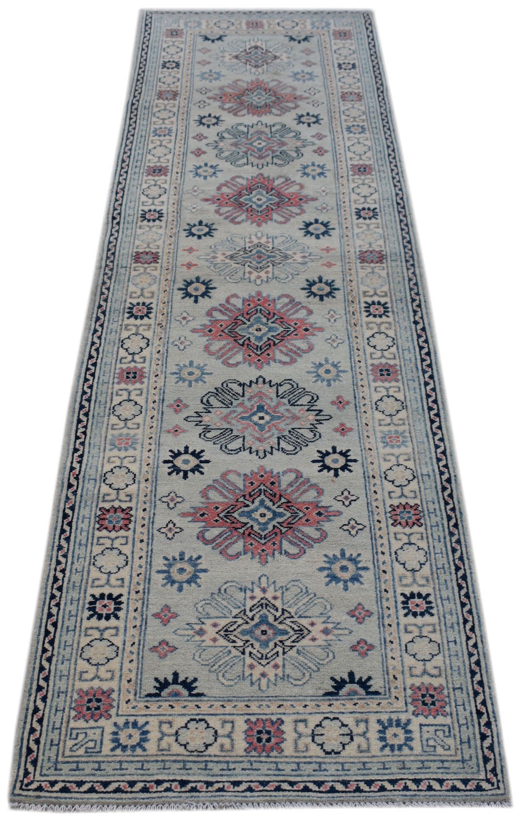 Handmade Afghan Kazakh runner rug featuring traditional geometric motifs in blue, pink, and cream.
