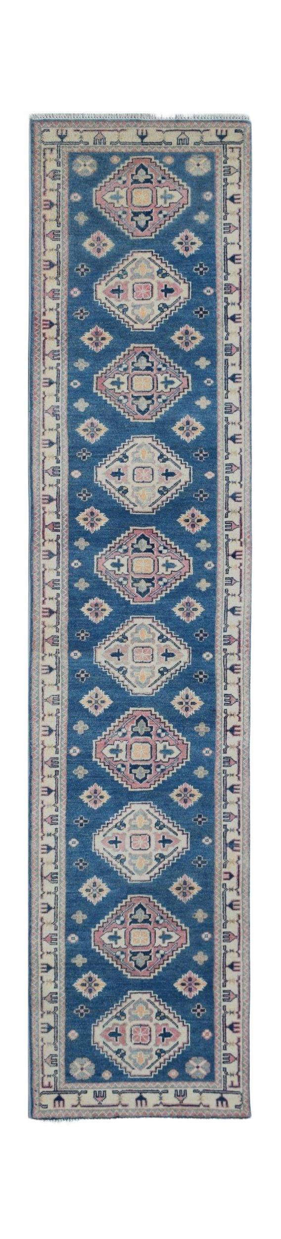 Handmade Afghan Kazakh runner rug featuring repeating diamond motifs in blue, pink, and cream.