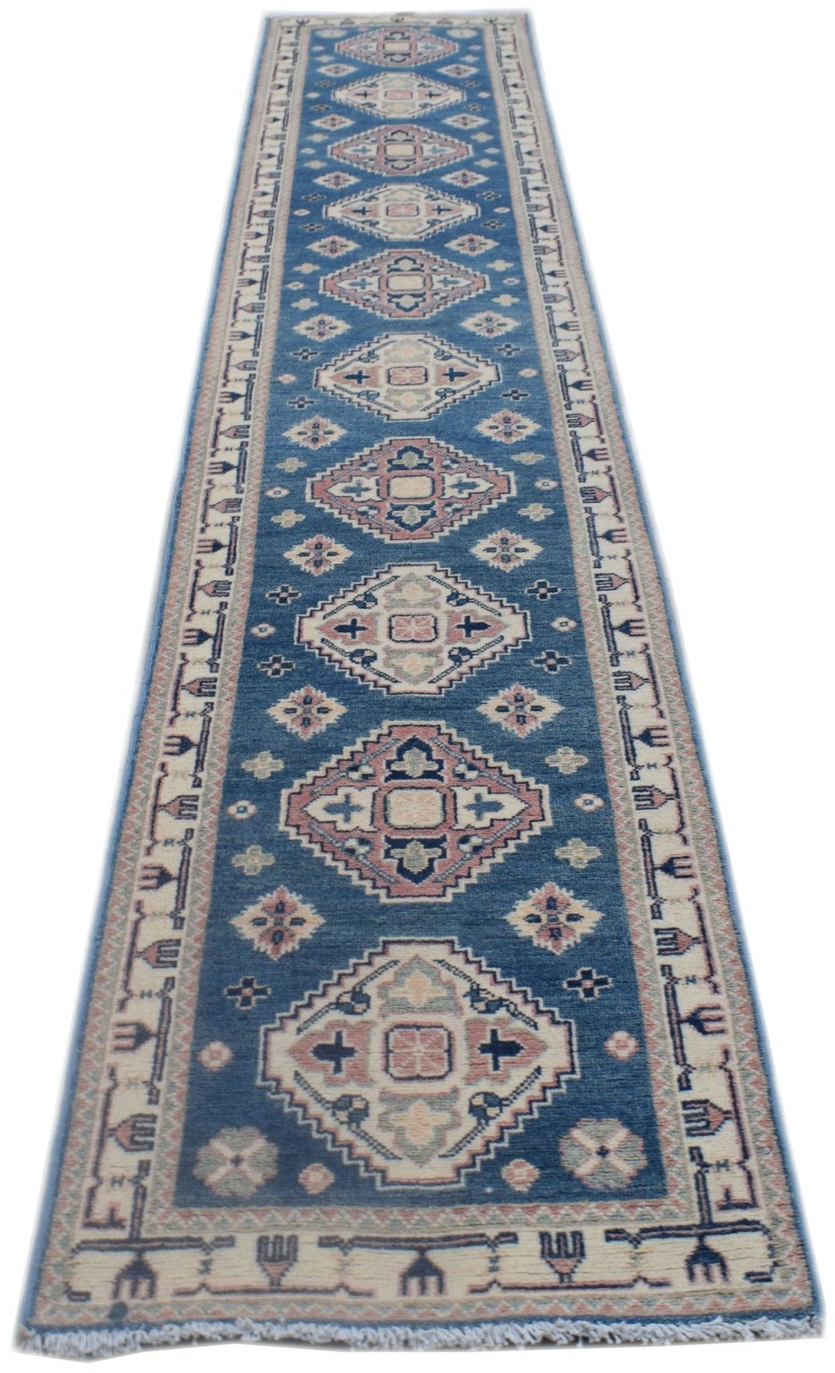A handmade Afghan Kazakh runner rug featuring traditional geometric motifs in blue and cream.