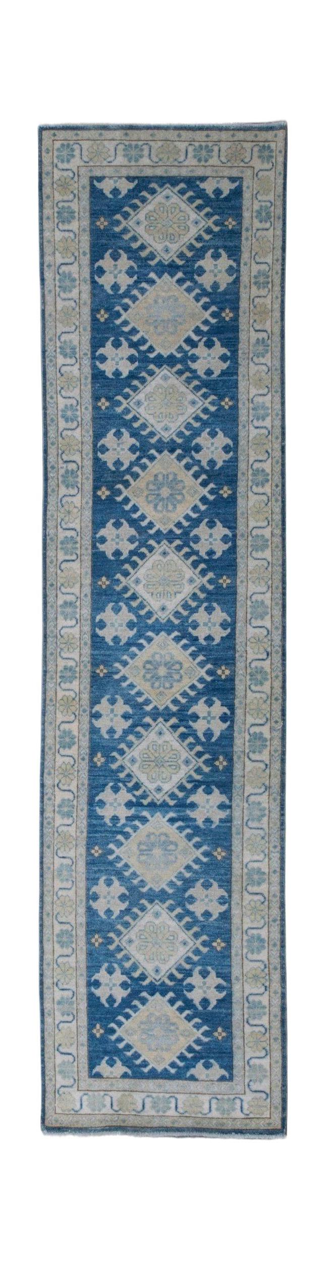 Handmade Afghan Kazakh runner rug featuring a repeating geometric diamond pattern in blue and beige.