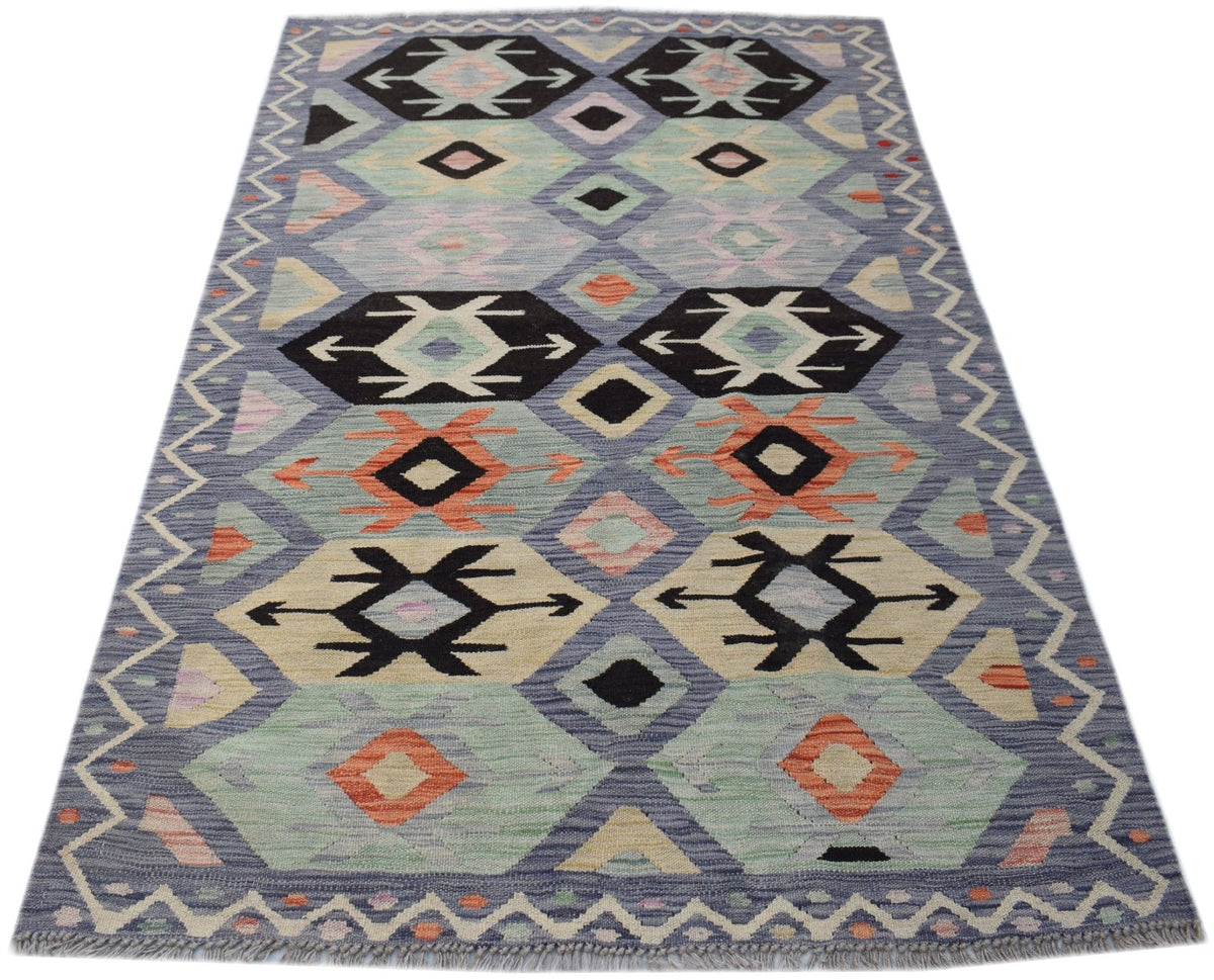 Handwoven Afghan Maimana kilim rug featuring a geometric pattern in blue, orange, and cream tones.